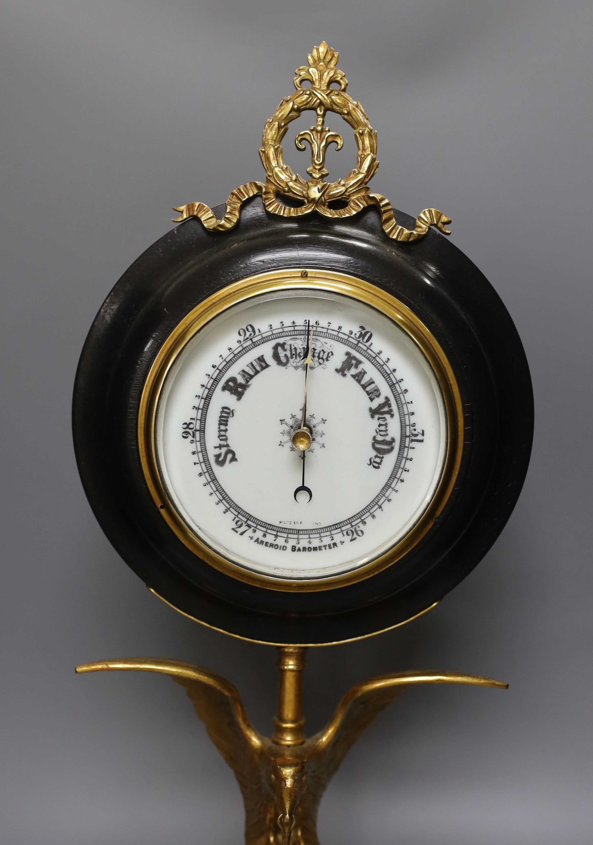 A large desk barometer on a gilt metal eagle mount - 58.5cm tall